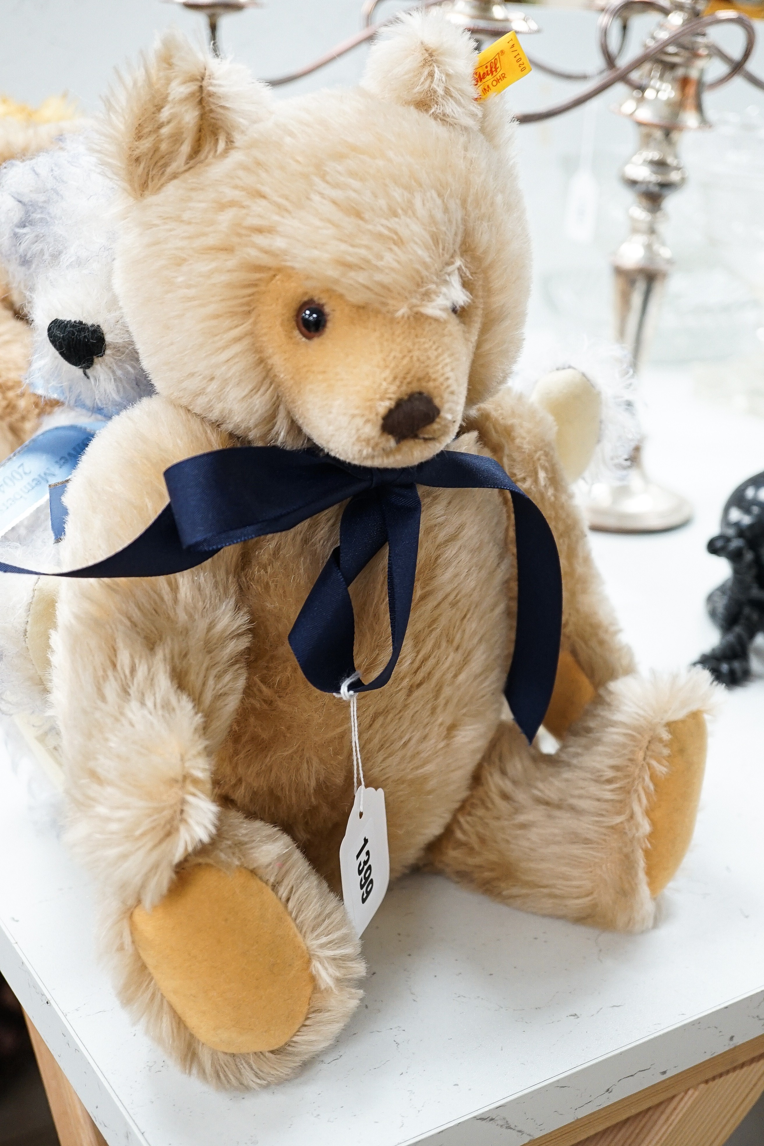 Four Deans teddy bears, a Steiff teddy and a Hermann teddy, Steiff bear, 39 cms high.